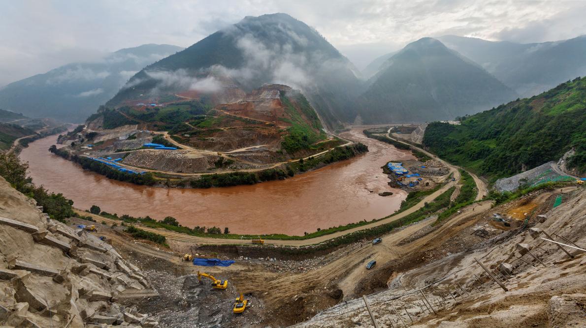 In 2012, when this photo was taken, construction of the Miaowei Dam was already underway. When finished next year, it will be the eighth dam on the Lancang River, China's name for its 1,300-mile stretch of the Mekong. PHOTOGRAPH BY DAVID GUTTENFELDER, AP/NATIONAL GEOGRAPHIC CREATIVE