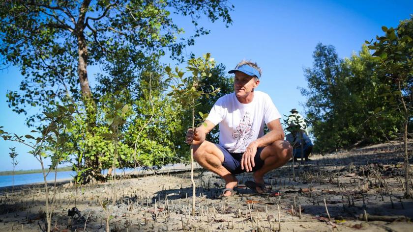Svein Rasmussen of Starboard, a Sustainable Surf partner, helps plant mangroves. SeaTrees aims to plant one million trees on behalf of the global surfing community in 2019. Photo by Sustainable Surf