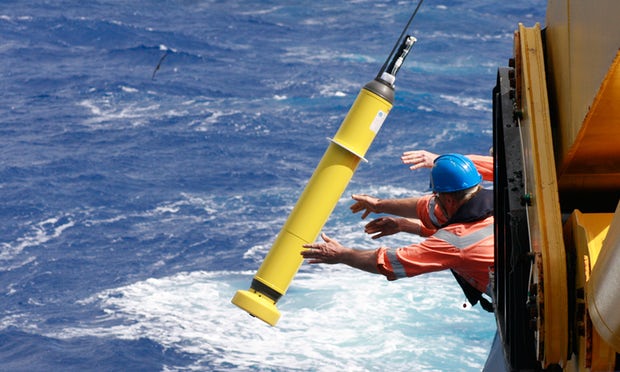 An Argo float is deployed into the ocean Photograph: CSIRO