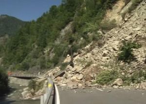 A rock slide blocks a road in Switzerland. Thawing permafrost is loosening rocks on mountainsides. Photo Credit: Creative Commons