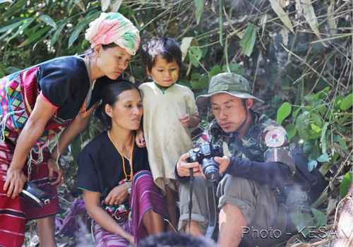The Karens with a member of the Kawthoolei Forestry Department of the Karen National Union (KNU). Photo - KESAN/Supplied