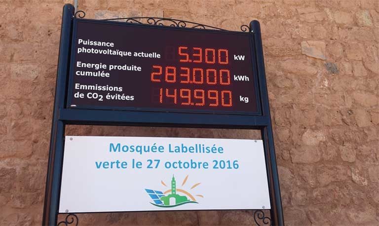 Koutoubia Mosque in Marrakech, Morocco, showing its solar energy production panel — placed prominently at the entrance to the mosque so that the faithful can see it when entering and feel proud of their accomplishment. Photo taken after Friday prayer in November 2016 during COP22 by Nana Firman courtesy of the Global Muslim Climate Network
