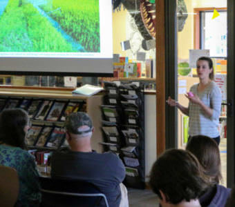 Lione Clare presenting her photo story to fellow Sitkans. (Photo by Cameron Clark/KCAW)