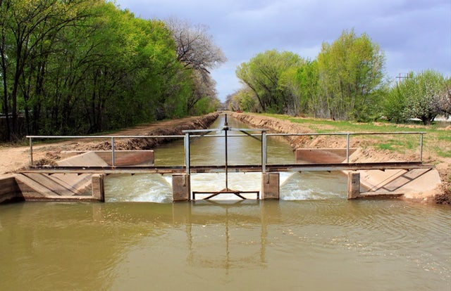 Water flows through one of the irrigation canals in Albuquerque, N.M., on Friday, March 31, 2017. A few water agencies across the West, including the Albuquerque Bernalillo County Water Utility Authority, have begun writing 100-year water plans.AP/Susan Montoya Bryan