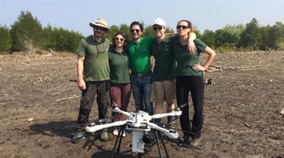 The BioCarbon Engineering team and their double propeller quadro-copter drone they hope will mean a brighter future for Myanmar's depleted mangroves [Ivan Ogilvie/ Al Jazeera]