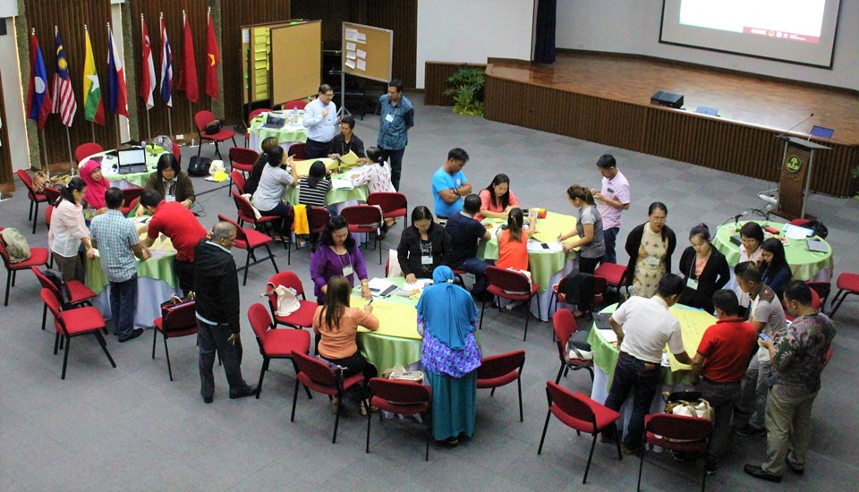 Participants of the training of trainers prepare their presentations on the various methods of utilizing school gardens for education.