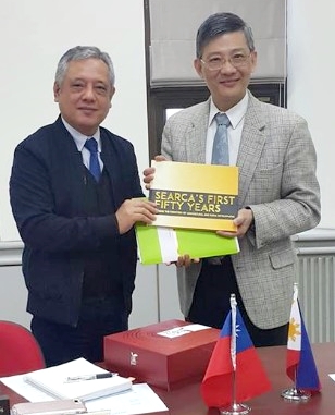 SEARCA Director Gil C. Saguiguit Jr. presents to Dr. Chung-hsiu Hung, Director General for international Affairs of Taiwan’s COA Executive Yuan, a copy of 'SEARCA's Fifty Years: Pushing the Frontiers of Agricultural and Rural Development' at their meeting in Taipei.