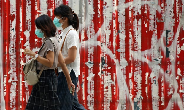 Women wear face masks as heavy air pollution continues to affect Bangkok Photograph: Narong Sangnak/EPA