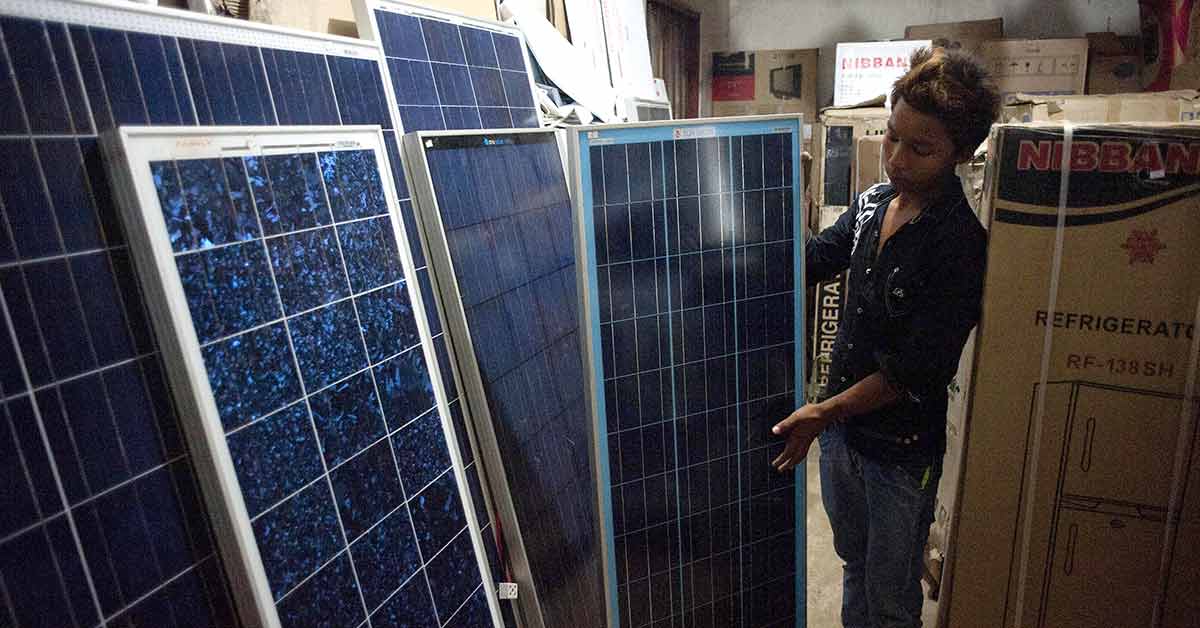 This photo shows a worker who sells solar panels at his store in Loikaw market, Kayah state, in eastern Myanmar. (AFP Photo)