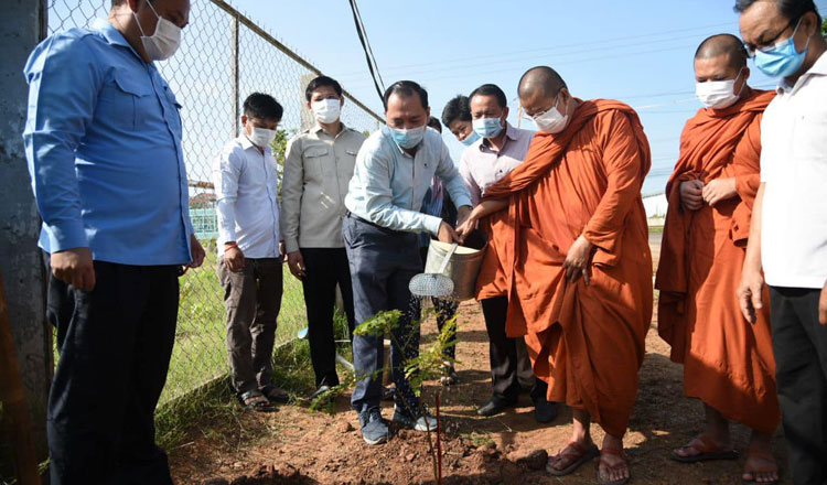Neth Pheaktra, Ministry of Environment spokesman, takes part in a tree planting campaign in Tboung Khmum province. MoE