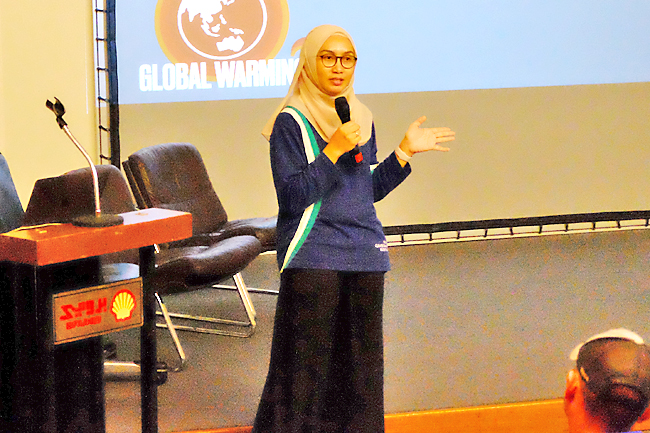 Brunei Climate Change Secretariat Head Noor Dina Zharina binti Haji Yahya speaks during the environmental awareness event last December. PHOTO: RIZAL FAISAL