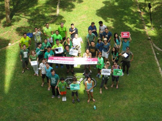 Participants of Climate Picnic SG wore green, brought posters showing their care for Mother Earth, and formed a green heart to send one message: Stop global warming (Photo: Bryan Kwa)
