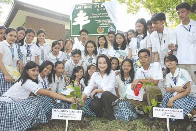 The author leading students in tree-planting activities of Luntiang Pilipinas.