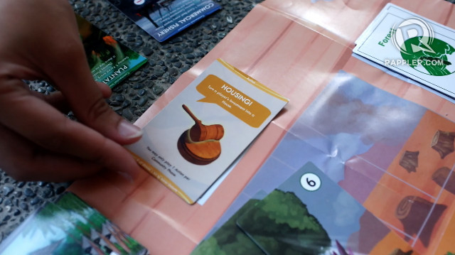 TRICKS. Players play an action card to lower a rival player's development points, for example, by turning their investment into a housing project