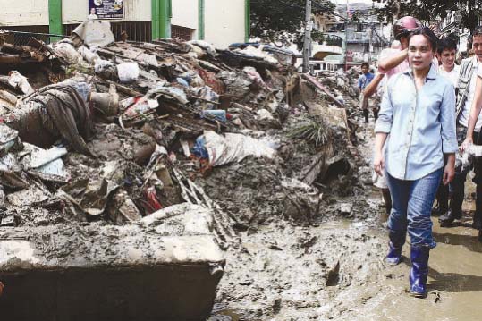 THE UNBEARABLE WEIGHT OF WATER. Examining the devastation left by Ondoy at the Marikina River Bank in 2009.