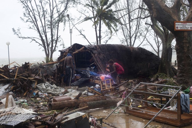 Pacific people search through debris flung around in Port Vila, Vanuatu, Saturday, March 14, 2015, in the aftermath of Cyclone Pam. Winds from the extremely powerful cyclone that blew through the Pacific’s Vanuatu archipelago are beginning to subside, revealing widespread destruction. (AP/UNICEF Pacific, Humans of Vanuatu)