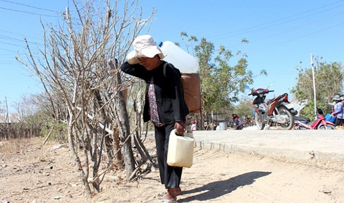 A Cham ethnic minority woman in the south-central province of Ninh Thuan fetches water on a daily basis for her family to use.