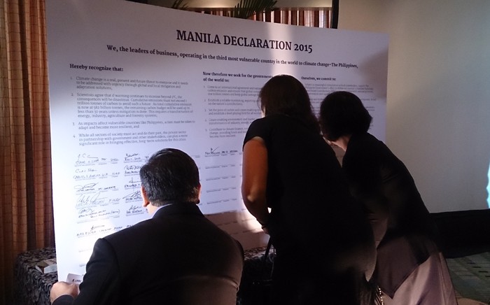 In Photo: Some of the country’s business leaders are signing the Manila Declaration 2015 for sustainable strategies on climate change in Makati City. Image Credits: Marianne Grace Sarmiento