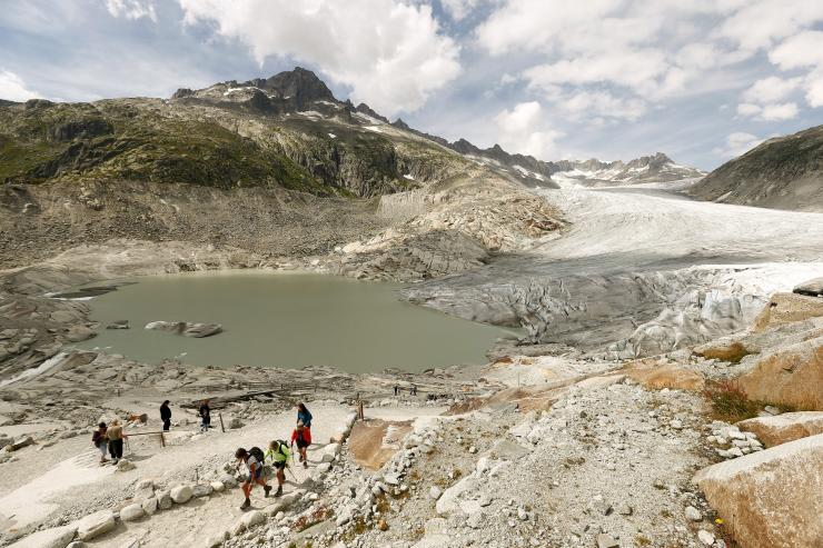 According to a new study, published in the International Glaciological Society’s Journal of Glaciology, the first decade of the twenty-first century witnessed a “historically unprecedented” rate of glacial ice melt. Pictured: Visitors walk in front of the Rhone glacier near the Furka mountain pass (2429 metres/7969 feet altitude) in the Swiss Alps August 6, 2015. Reuters/Arnd Wiegmann