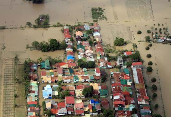 Floodwaters inundate homes and rice fields in northern Philippines in the wake of typhoon Lando. AP